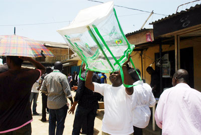 INEC official displays an empty ballot box