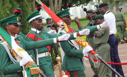 Men of the Colour Party on parade during the exchange of Presidential Guards as part of events to mark the 51st National Day Celebrations at the State House, Abuja. Photo by Abayomi Adeshida