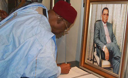 Late Dr. Umaru Dikko signing the condolence register during his condolence visit to the family of the late Alex Ibru, at their Ikoyi residence, on Tuesday.