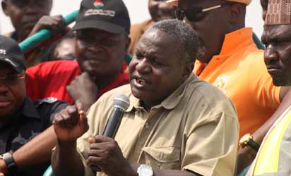 resident ,Nigerian Labour Congress (NLC),Omar Abdulwaheed (middle) addressing protesters on the outcome of the meeting with the President on the fuel subsidy in Abuja yesterday. Photo by Gbemiga Olamikan.