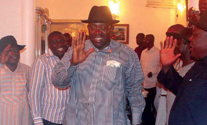 Governor-elect of Bayelsa State, Henry Dickson (middle) acknowledging cheers from supporters at his home after his victory at the 2012 Bayelsa State Governorship election in Yenagoa, Bayelsa, yesterday. Photo: Nwankpa Chijioke