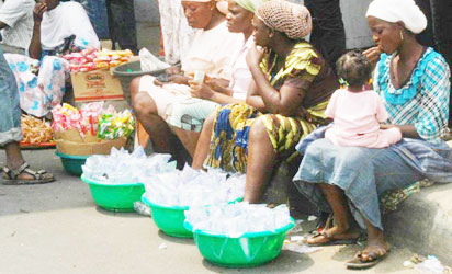 Pure (sachet) water peddlers in the Sun in Lagos