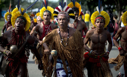 Brazilian Pataxo natives sing at the People's Summit in Rio de Janeiro, on June 19, 2012, in the sidelines of the UN Conference on Sustainable Development, Rio+20. The UN conference, which marks the 20th anniversary of the Earth Summit . AFP PHOTO