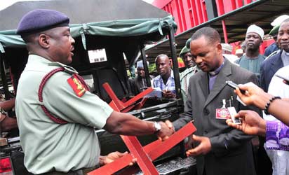 Chief of Civil Military Affairs, Nigerian Army, Maj.-Gen. Bitrus Kwaji (L), presenting the New Vehicle Stopper, Donated by the Nigerian Army to Executive Secretary, Abuja National Mosque, Alhaji Ibrahim Abubakar, in Abuja on Thursday (26/7/12).NAN Photo