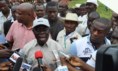 Governor Adams Oshiomhole of Edo State addressing journalists at Iyamho Primary School.