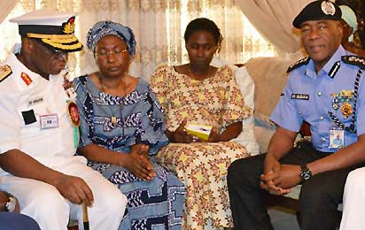 CONDOLENCE—From Left: Admiral Ola Sa`Ad Ibrahim, Chief of Defence Staff; Mrs Alero Azazi, widow; daughter, and Mr. Mohammed Abubakar, Inspector-General of Police during a condolence visit to late General Azazi's family, yesterday, in Lagos.