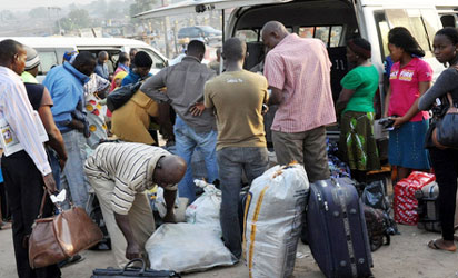 Commuters travelling out of Lagos at Ojota park, yesterday.
