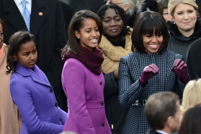 US Frist Lady Michelle Obama arrives with daughters Sasha (L) and Malia for the 57th Presidential Inauguration on January 21, 2013. US President Barack Obama will be ceremonially sworn in for a second term. AFP