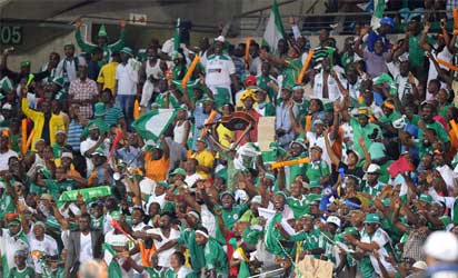 Nigeria supporters celebrate their team's 2-0 win over Ethiopia on January 29, 2013 after a 2013 African Cup of Nations Group C football match at the Royal Bafokeng stadium in Rustenburg. AFP PHOTO