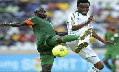 CRACKING... Nigeria’s midfielder Mikel John Obi (R) vies with Zambia’s midfielder Chisamba Lungu during their match yesterday at Mbombela Stadium in Nelspruit. AFP PHOTO