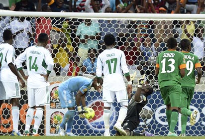 Zambia's goalkeeper Danny Munyao (3rd R) celebrates after scoring a penalty on January 25, 2013 during an Africa Cup of Nations 2013 group A football match against Nigeria at the Mbombela stadium in Nelspruit. AFP PHOTO .