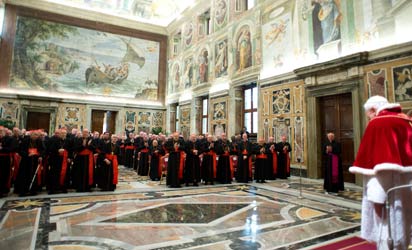 Pope Benedict XVI (backing camera) delivering a speech to cardinals in the Vatican's ornate Clementine Hall at the Vatican. Pope Benedict XVI vowed "unconditional obedience" to his successor on his historic final day as leader of the world's 1.2 billion Catholics, when he will become the first pontiff to resign since the Middle Ages. AFP Photo