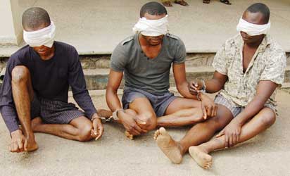 The suspected kidnappers paraded Monday.