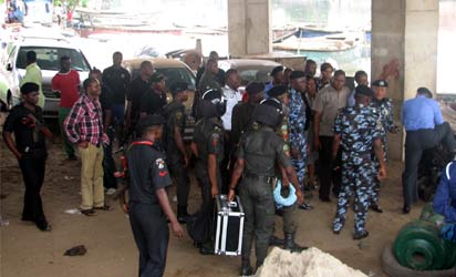 The Police bomb disposal unit and security personnel at the scene of the explosion, under the Festac link bridge along Amuwo Odofin in Lagos Photo: Biodun Ogunleye