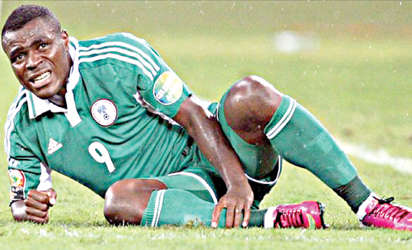 IN PAINS … Super Eagles striker, Emmanuel Emenike writhing in pains after he got knocked in the semi final match against Mali at the Africa Nations Cup in South Africa last month. He has lambasted both the NFF and Coach Stephen Keshi for not asking after his state of health since after the Nations Cup.