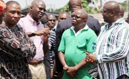 The Ladipo International Auto Spare Parts Market during the visit of Governor Babatunde Fashola, yesterday. INSET: Lagos State Governor, Mr Babatunde Fashola (middle); Commissioner for Environment, Mr. Tunji Bello (left); Director of Enforcement, Ministry of the Environment, Oluwatoyin Adesina Onisarotu (2nd right); Chairman, Mushin Local Government Area, Mr. Babatunde Adepitan (2nd left) and President General, Ladipo Central Executive Auto Dealers Association, Comrade Ikechukwu Animalu.