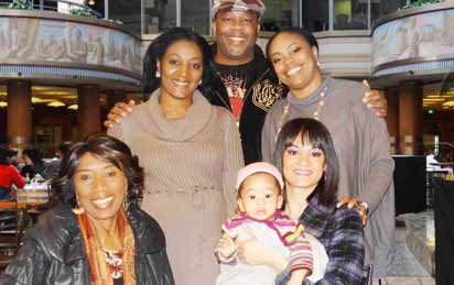 Christy Stallings(1st left) with son, Douglas, wife carrying her grandson and top right, daughter, Delia Eyitemi Stallings