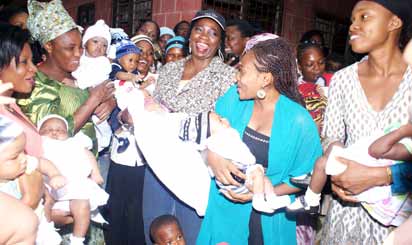 Dabiri-Erewa, (m) with joyful mothers during the commissioning of a solar powered motorized borehole at Ikorodu Local Government Children Centre in Ikorodu. Photo by Lamidi Bamidele