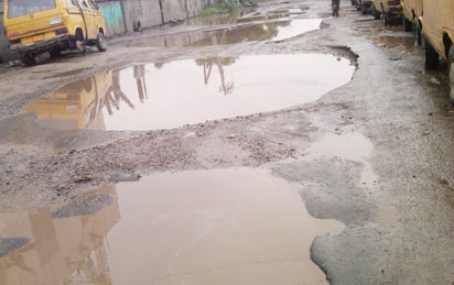 Ottor-Wharf/Awodi-Ora Road in Ajegunle...in a bad state