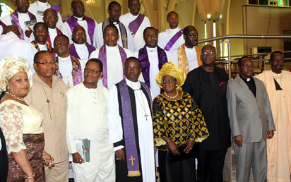 Primate of All Nigeria Anglican Communion, The Most Rev. NIcholas Okoh flanked by Finance MInister, Dr. Ngozi Okonjo-Iweala and Member Achebe Burial Committee, Prof. Uzordinma Nwagi while Information MInister, Mr. Malaran Maku (r); Wife of former Senate President, Senator Magery Chuba-Okadigbo (L); Anambra State Deputy Governor, Mr. Emeka Sibeudu (2L) and Former FCT CAN Chairman, Rev. Williams Okoye (2R) join in a group photograph after the Commendation Service in honour and Memory of Prof. Chinualomogu Achebe at the National Christian Centre, Abuja. Photo: Abayomi Adeshida.