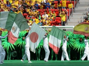 Artists carry the national flags of some of the countries (L-R: Nigeria, Mexico, Japan, Italy and Spain) participating in the FIFA Confederations Cup Brazil 2013, as they perform during the opening ceremony of the football tournament, at the National Stadium in Brasilia on June 15, 2013. AFP PHOTO / EVARISTO SA