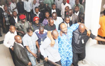 DETAINED—Detained Majority Leader of Rivers State House of Assembly, Chidi Lloyd (M), being assisted to the court in Port Harcourt, Wednesday