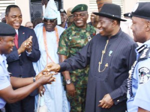 President Jonathan presenting house keys to a beneficiary of of the Goodluck Jonathan Housing Estate, Idimu, Lagosousing Estate giving a salute to guests at the official unveiling of the Estate on Friday July 19, 2013 in Lagos, watching with admiration are Mr. Olatunde Ayeni, Chairman, ASO Savings & Loans- financier of the Goodluck Jonathan Housing Estate, Idimu, Lagos; Oba of Lagos, Rilwan Akiolu, Lieutenant Colonel Ogogbane Adegbe Aide de Camp to Mr. President, Special Guest of Honour Dr Ebele Jonathan, President, Commander in Chief of Armed Forces of Nigeria and Mr. Muhammed Abubakar, Inspector General of Police at the official unveiling of the 200 of the 504 units of 3-Bedroom block of flats. Photo by Lamidi Bamdiele