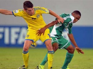 Musa Yahaya challenges for the ball with Erdal Rakip of Sweden during the FIFA U17 group F match between Sweden and Nigeria at Khalifa Bin Zayed Stadium on October 22, 2013 in Al Ain, United Arab Emirates. (Photo by FIFA)