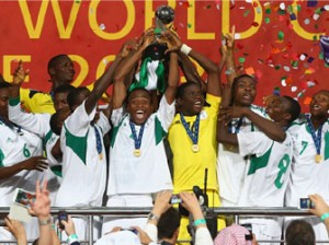 Akinjide Idowu (C) of Nigeria and his team-mates celebrate their victory with the trophy during the FIFA World Cup UAE 2013 Final between Nigeria and Mexico at Mohamed Bin Zayed Stadium on November 8, 2013 in Abu Dhabi, United Arab Emirates. (Photo FIFA)