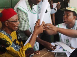 85 year old Chief Michael Iwoba, a pensioner being accredited to vote at Eri Primary School, Aguleri.