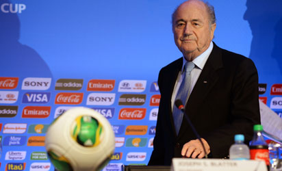BRAZIL, Costa do Sauipe : Fifa president Joseph Blatter gestures during a press conference in Costa do Sauipe, state of Bahia, Brazil on December 3, 2013. The 2014 FIFA World Cup Brazil final draw will take place December 6. AFP PHOTO