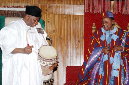 President Goodluck Jonathan on the talking drum presented to him by the Alafin of Oyo Oba Lamidi Olayiwola Adeyemi(iii) in his Palace in Oyo yesterday.