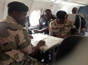 File photo strategizing: The Chief of Army Staff, Lt-Gen Kenneth Minima (left); his Air Force counterpart, Air Marshal Adesola Amosu (middle) and General Officer Commanding 3rd Division, Nigerian Army, Maj. Gen John Zaruwa, aboard a Nigerian Air Force plane strategising with the aid of maps in the ongoing counter-terrorist operations in Borno, Yobe and Adamawa states, during a visit to the area, weekend.