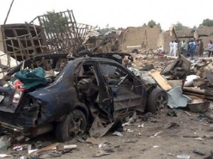 NIGERIA, Maiduguri : BEST AVAILABLE QUALITY
People gather on March 2, 2014 near the wreckage at the scene where two explosions rocked a crowded neigbourhood in Maiduguri's Gomaris district on the evening of March 1. At least 35 people were killed following two explosions in a crowded neighbourhood of Nigeria's restless northeastern city of Maiduguri, a stronghold of Boko Haram Islamists, police said March 2. "We are still counting. So far we have counted 35 bodies. Our men are still working with rescue workers at the scene," Borno state police commissioner Lawal Tanko said. AFP PHOTO /