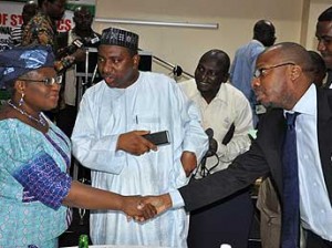 *Briefing on Result of GDP in Nigeria: Minister of Finance and Coordinating Minister of Economy, Dr. Ngozi Okonjo –Iweala chatting with Minister of National Planning Amb. Bashiru Yuguda and Statistician –General of the Federation and CEO of National Bureau of Statistics Dr. Yemi Kale during presentation of Preliminary Results of the Rebased Nominal Gross Domestic Product ( GDP) Estimates from Nigeria 2010 to 2013 held in Abuja. Photo by Gbemiga Olamikan.