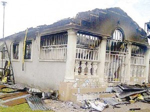 *The house razed during mayhem