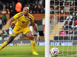 Austin Ejide watches as Scotland's defender Charlie Mulgrew scores the opening goal during the international friendly football match between Nigeria and Scotland