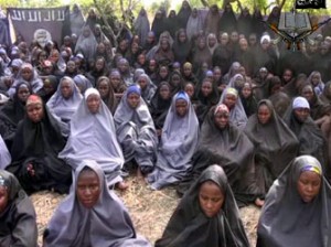 A screengrab taken on May 12, 2014, from a video of Nigerian Islamist extremist group Boko Haram obtained by AFP shows girls, wearing the full-length hijab and praying in an undisclosed rural location. Boko Haram released a new video on claiming to show the missing Nigerian schoolgirls, alleging they had converted to Islam and would not be released until all militant prisoners were freed. A total of 276 girls were abducted on April 14 from the northeastern town of Chibok, in Borno state, which has a sizeable Christian community. Some 223 are still missing.