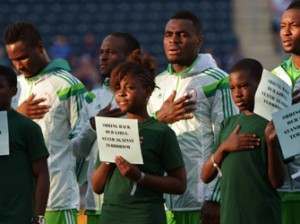 UNITED STATES, CHESTER : CHESTER, PA - JUNE 3: The player escorts for the Nigerian National Team hold signs in support of the girls kidnapped in Nigeria, before the game against Greece during an international friendly match at PPL Park on June 3, 2014 in Chester, Pennsylvania. AFP