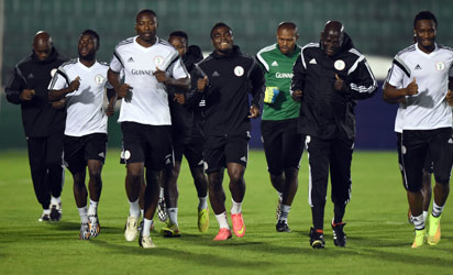 BRAZIL, Campinas : Nigeria's team members jog during a training session in Campinas, Sao Paulo, on June 18, 2014, during the 2014 FIFA World Cup. AFP PHOTO