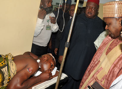 VICTIMS OF ABUJA BLAST—Vice-President Namadi Sambo and SGF, Anyim Pius Anyim (top left) visit victims of the Abuja bomb explosion at Maitama General Hospital, Abuja, yesterday.