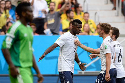 France's midfielder Paul Pogba (C) celebrates with teammates after scoring a goal during the round of 16 football match between France and Nigeria at the Mane Garrincha National Stadium in Brasilia during the 2014 FIFA World Cup on June 30, 2014. AFP PHOTO .