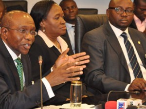 New CBN Governor— From left, new CBN Governor, Mr Godwin Emefiele, his deputies, Sarah Alade and Adebayo Adelabu during a World Press Conference in Abuja, yesterday. Photo: Gbemiga Olamikan. See story on Page 8