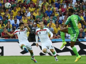 Iran's defender Khosro Heidari and Iran's midfielder Andranik Teymourian (C) fights for the ball with Nigeria's midfielder John Obi Mikel (R) during a Group F football match between Iran and Nigeria at the Baixada Arena in Curitiba at the 2014 FIFA World Cup on June 16, 2014. AFP PHOTO / JEWEL SAMAD