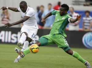 UNITED STATES, JACKSONVILLE : JACKSONVILLE, FL - Forward Jozy Altidore #17 of the United States shoots and scores his second game of the game behind defender Joseph Yobo #2 of Nigeria during the international friendly match at EverBank Field on June 7, 2014 in Jacksonville, Florida. AFP
