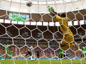 Nigeria goalkeeper Vincent Enyeama saves a shot by Paul Pogba of France.