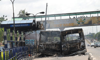 Some of BRT Buses put on fire by army of the killing one of them by BRT Driver at Palmgrove, bus-stop on Friday 4-7-2014, PHOTO; Kehinde Gbadamosi