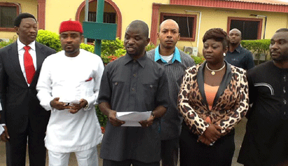 •Madam Speaker flanked by her men