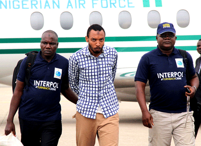 NYANYA BLAST CO-MASTERMIND—Nyanya bombing co-mastermind, Aminu Sadiq Ogwuche (M), arriving with Interpol officials at the Nnamdi Azikiwe International Airport, Abuja, yesterday. Inset: Mohammed Zakari, Boko Haram's alleged Chief Butcher arrested by Police in Bauchi.