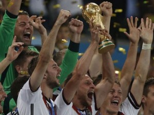 WORLD CUP—Germany's forward Andre Schuerrle (C) holds the trophy as he celebrates with teammates after his team's victory in the final football match between Germany and Argentina for the FIFA World Cup at The Maracana Stadium in Rio de Janeiro, . AFP PHOTO.